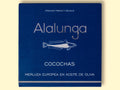 A tin of hake cheeks in olive oil in square-shaped blue card packaging against a yellow table background. The packaging has Alalunga written in silver lettering above a white illustration of a hake.