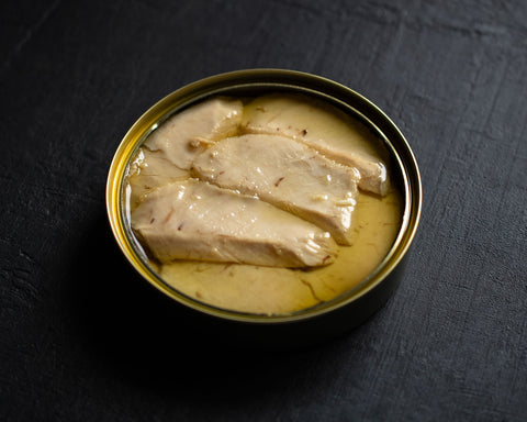 An open tin of Albacore tuna tarantelo in olive oil from Alalunga.