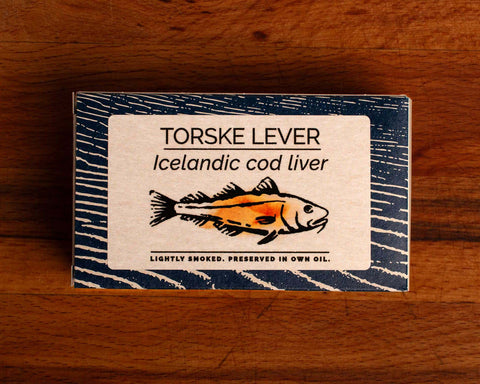 A tin of Icelandic cod liver in white and blue packaging, featuring an illustration of a cod with the text "lightly smoked" beneath.