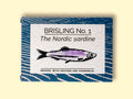 A tin of sprats in a rectangular box with a blue border and a painting of a purple sprat on the front, against a dark wood background.