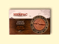 A tin of bluefin tuna loin in rectangular card packaging. The Herpac logo is written in red lettering above a reddish-brown sea with seagulls flying over it. There is a golden porthole on the right hand side of the packaging through which you can see the meaty tuna loin.