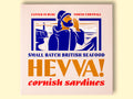 Box containing Cornish sardines from Hevva! The box is illustrated with a fisherman calling out over the Cornish coast with cliffs and a lighthouse in the background. The box is colourful with Hevva! written in golden, embossed lettering
