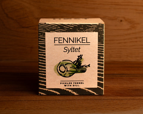 A tin of pickled with dill in light grey square card packaging with blue borders, featuring an illustration of a dill plant.