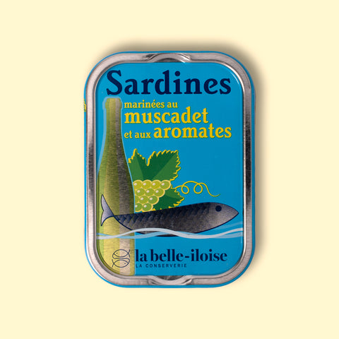 La Belle Iloise sardines with muscadet wine, in a blue tin illustrated with a wine bottle, grapes and a fish.