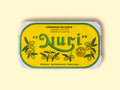A tin of sardines in a yellow paper wrap with a green and white border. Nuri is written in green lettering above some small olive branches.