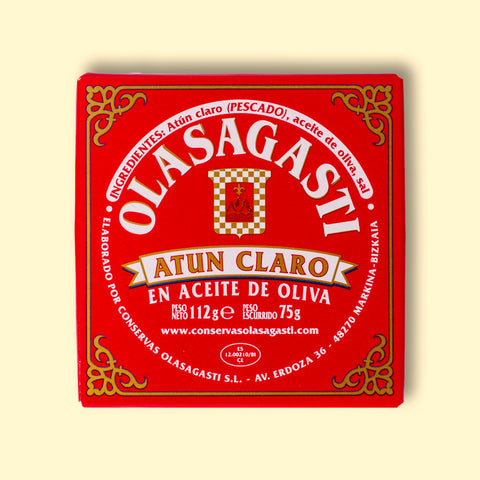 A square red box with Olasagasti written in white lettering inside an ornate gold border.