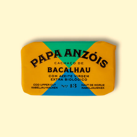 Cod in organic extra virgin olive oil, in a multicoloured wrapped tin with Portuguese words that read cod in organic olive oil.