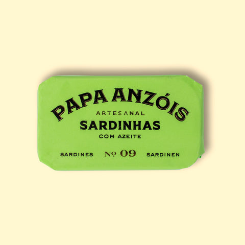 A tin of sardines in olive oil in lime green packaging, featuring the Papa Anzois brand name on top.