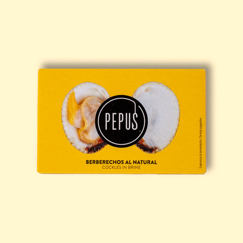 A tin of cockles in yellow card packaging with an image of an open cockle and the round Pepus logo on the front