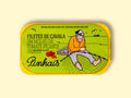 Mackerel fillets in spicy tomato in a green paper wrap with a yellow border. There is a drawing of a fisherman mending a fishing net on the front., and an image of a tomato and a red chilli pepper