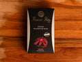A tin of Ramon Pena octopus in olive oil, in black card packaging featuring an illustration of octopus tentacles on the front.