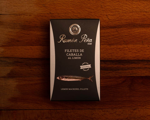 A tin of Ramon Pena lemon mackerel fillets in black rectangular packaging, with an image of a mackerel.
