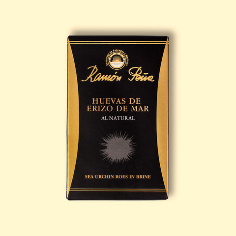 Black and gold rectangular box with Ramón Peña written in gold above a grey image of a sea urchin.