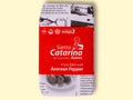 A tin of tuna with pepper, in newspaper packaging with a red band around it with Santa Catarina written in white lettering on it.