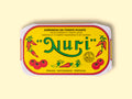 A tin of sardines in spicy tomato in a yellow paper wrap with a white and red border. Nuri is written in red above images of tomatoes and red chilli peppers.