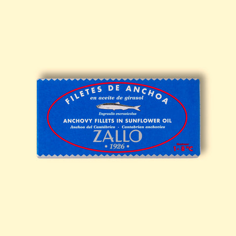 A tin of Bonito del Norte tuna in red and black packaging with a drawing of a tuna on the front and Zallo written in white lettering