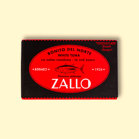 A tin of Bonito del Norte tuna in red and black packaging with a drawing of a tuna on the front and Zallo written in white lettering