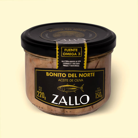 A jar of tuna fillets in olive oil with black and yellow labelling