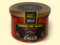 A jar of Zallo tuna fillets in a red-coloured Espelette pepper--spiked sauce with a gold lid and black, gold and red labelling