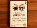 A tin of butterfly anchovies in white card packaging with brown borders, featuring the text "Conservas Angelachu" on the front.