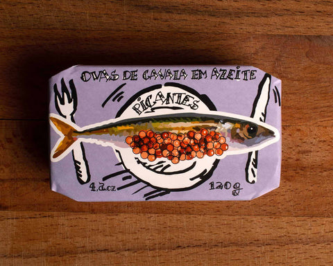 A tin in a glossy lilac-coloured wrap with a painting of a mackerel and its roe on the front