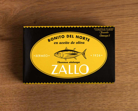 A rectangular tin of Bonito del Norte tuna in black and yellow packaging with an image of a tuna fish on the front and Zallo written in white lettering