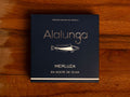 Hake in olive oil in square, blue card packaging with Alalunga written in silver lettering above an illustration of a hake.