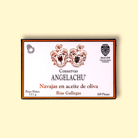 Razor clams in a white rectangular box with a black border, on a light yellow backdrop.