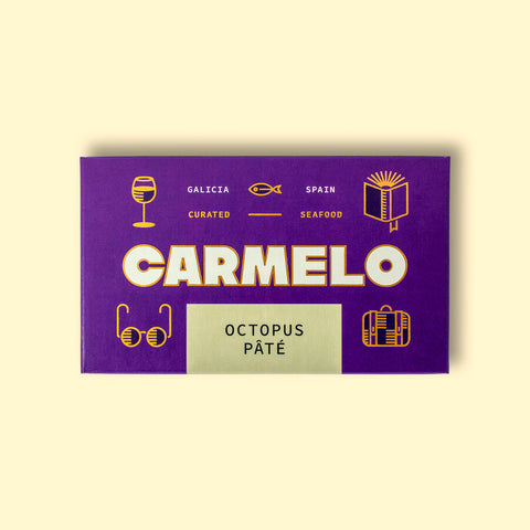 Carmelo octopus pate in an indigo box decorated with gold illustrations.