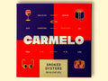 Carmelo brand with the iconic blue and red pattern on a yellow wooden table