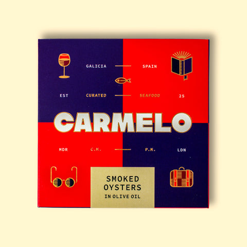 Carmelo brand with the iconic blue and red pattern on a yellow wooden table