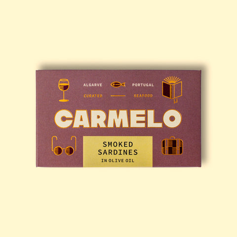 Carmelo smoked sardines in a luxurious box with golden illustrations, 