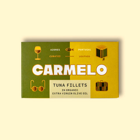 Carmelo tuna fillets in the signature iconic green and yellow packaging with golden illustrations