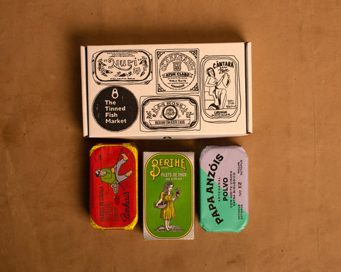 Collection of vintage-style tinned fish with octopus and mackerel