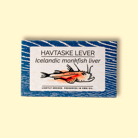 A rectangular tin of monkfish liver in white and blue packaging, featuring an illustration of a monkfish with the text "lightly smoked" below.