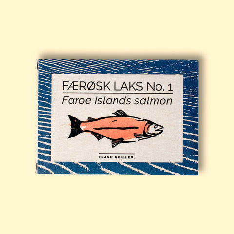 A tin with a blue border and a pink-coloured salmon on the front