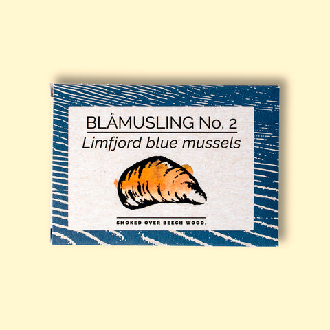 A rectangular box with a blue border and an image of a mussel shell painted orange on the front.