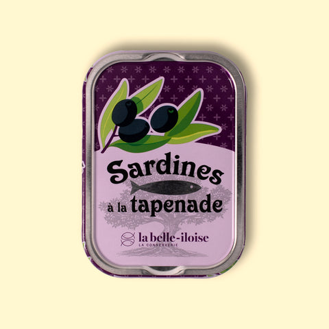 ardines with black olive tapenade, in a purple tin illustrated with a fish and olives.