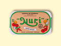 A paper-wrapped tin of Nuri sardines with the Nuri logo in green lettering against beige background, and images of chillies, tomatoes, onion and coriander either side of the log.