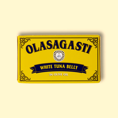 A tin of tuna belly in a rectangular yellow box with blue lettering and a gold border.