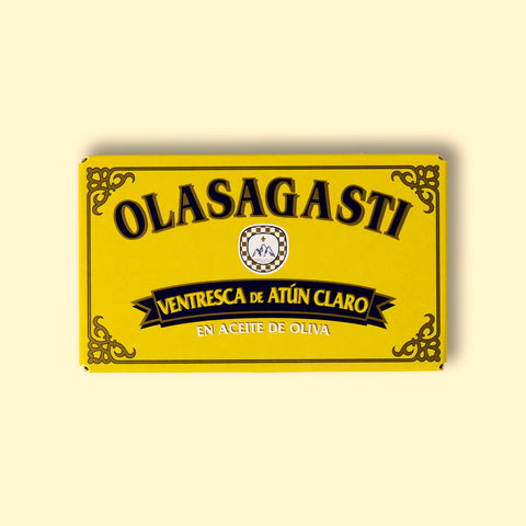 A tin of yellowfin tuna belly in a rectangular yellow box with blue lettering and a gold border. 