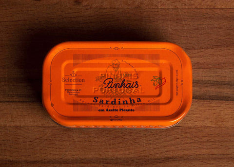 Bright orange tin of Pinhais limited edition sardines with chilli