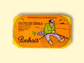 Mackerel fillets in an orange wrap with a yellow border. There is a drawing of a fisherman mending a fishing net on the front.