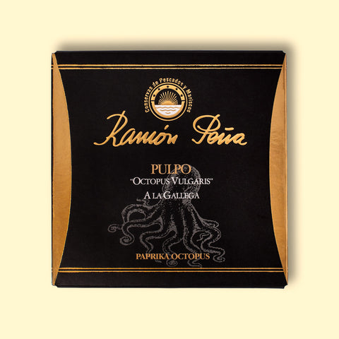 Tinned paprika octopus in black and gold packaging. Ramón Peña is written in raised gold lettering above a silver grey image of an octopus on the front of the packaging.
