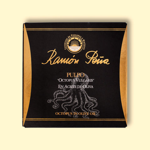Tinned octopus in black and gold packaging. Ramón Peña is written in raised gold lettering above a silver grey image of an octopus on the front of the packaging.