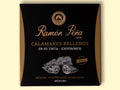 A tin of stuffed squid in black and gold packaging. Ramón Peña is written in gold lettering above a silver-grey image of a squid