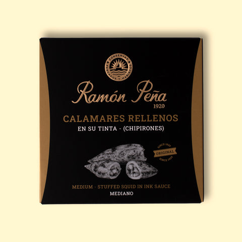 A tin of stuffed squid in black and gold packaging. Ramón Peña is written in gold lettering above a silver-grey image of a squid