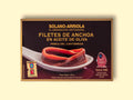 Anchovy fillets in rectangular packaging with brown borders, featuring an image of filleted anchovies resting on a spoon. 
