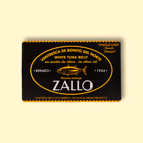 A rectangular box with light orange lettering and an image of a tuna, with Zallo written in white beneath it