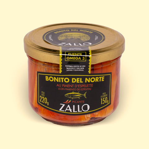 A jar of Zallo tuna fillets in a red-coloured Espelette pepper--spiked sauce with a gold lid and black, gold and red labelling
